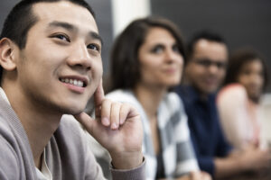 People paying attention and smiling/