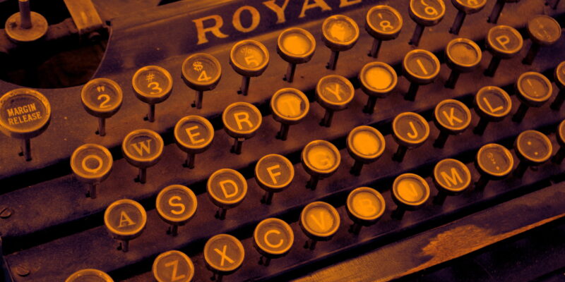 Sepia toned photo of old fashioned type writer