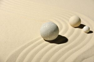 Three balls in sand, like a zen garden.